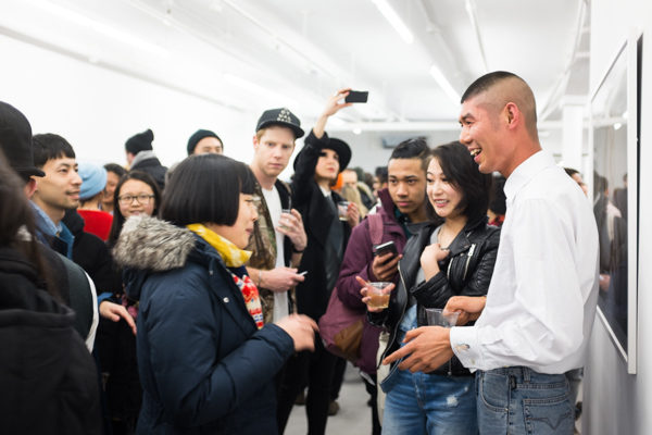 Ren Hang at the opening of "Night and Day" at Capricious 88. Photograph by Max Mikulecky