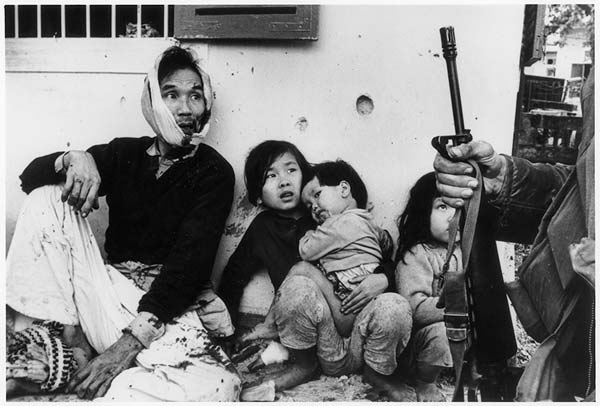 Vietnamese family after a grenade-attack on their bunker, Hue, 1968